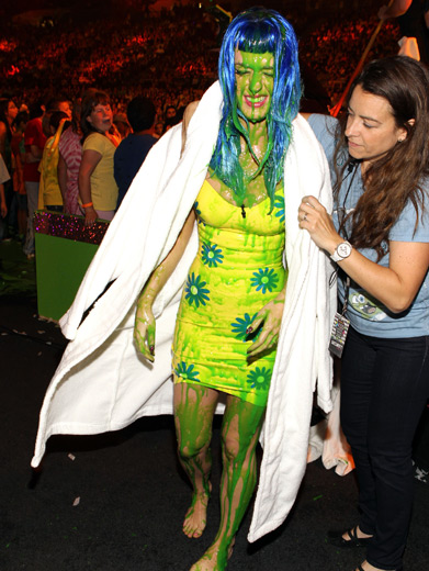 Katy Perry|Pop tart Katy Perry recovers offstage after what may turn out to be the most famous sliming of all time.