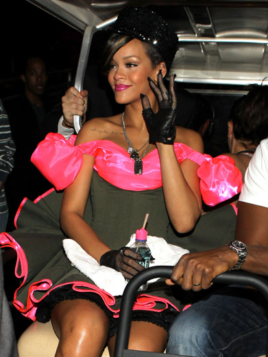 Rihanna|Before she rode a pink camo tank onstage, Rihanna scooted around behind the scenes in a VIP golf cart.