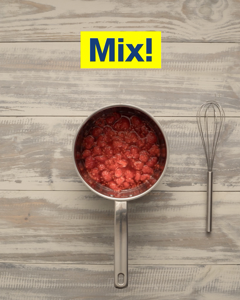 A saucepan full of raspberries, sugar, and water. Text: Mix!