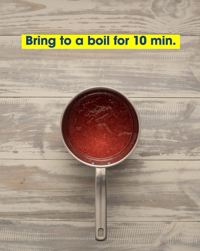 A saucepan full of a red mixture. Text: Bring to a boil for 10 min.