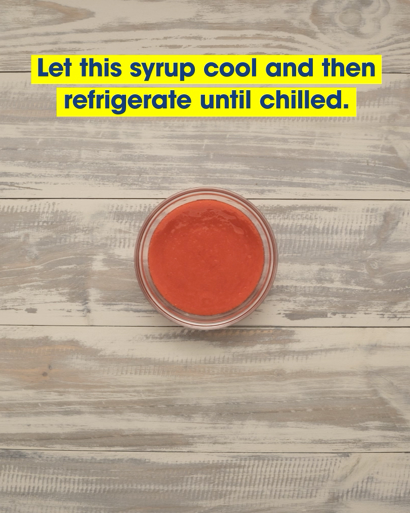 A cup of red Piragua, a Puerto Rican shaved ice dessert, seen from above. Text: let this syrup cool and then refrigerate until chilled.